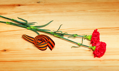 Flowers and St. George ribbon - a symbol of the Victory