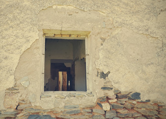 window of an abandoned house