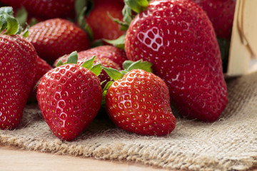 Pile of red strawberries on jute