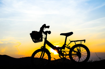 Fototapeta na wymiar Bicycle silhouette with sun set.