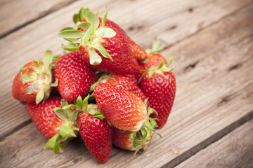 Closeup of fresh strawberries on old table