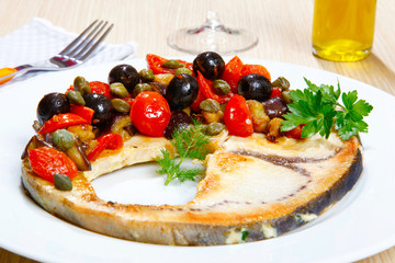 Swordish with tomatoes, capers and olives, sicilian recipe