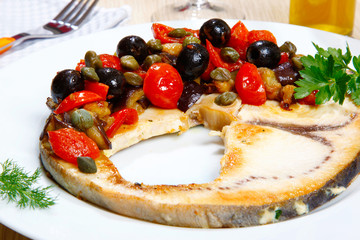 Swordish with tomatoes, capers and olives, sicilian recipe