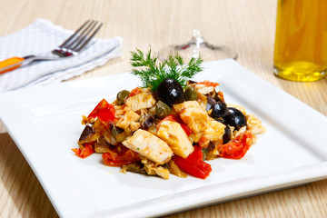 Swordish with tomatoes, capers and olives, sicilian recipe