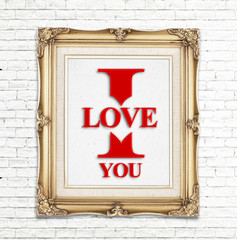 "I love you" word in golden vintage photo frame on white brick w