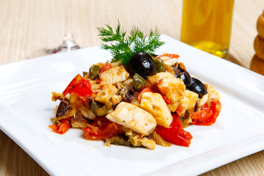 Swordish with tomatoes, capers and olives, sicilian recipe