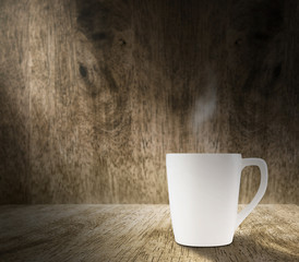 Lighting from window with hot white coffee cup in hardwood room
