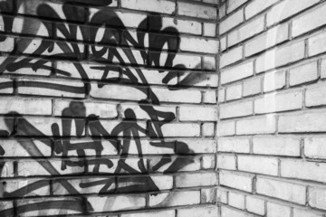 Abstract graffiti fragment on gray brick wal