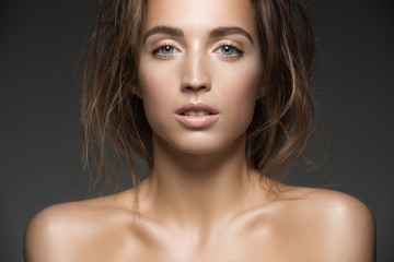 Fashion portrait of young beautiful woman with fresh makeup
