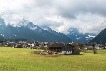 Fototapeta na wymiar Mayrhofen, Austria with low clouds covering mountains