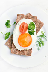 Fried egg on crispbread, top view