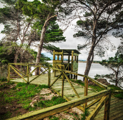 Fototapeta na wymiar wooden birdwatching cabin by the water
