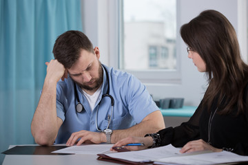 Physician talking with lawyer