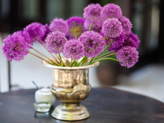 Allium flowers bouquet in a stylish decorative vase