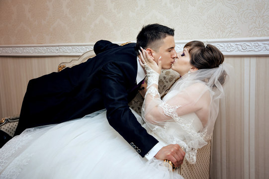 Young couple kissing at wedding