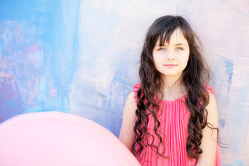 Pretty little girl on bright background, copyspace