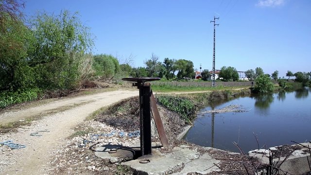 mountain bicycle riding in the countryside, irrigation channel