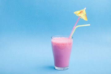 whistle, party hat and lollipop on the blue background