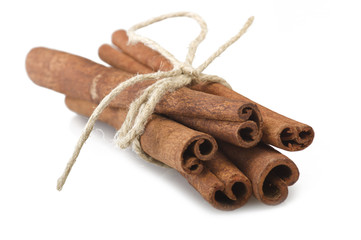 cinnamon stick spice close up on the white