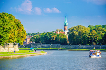 Vistula river, tourist boat and Jewish district, Cracow, Poland