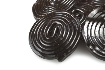 Liqorice wheels candies close up on the white