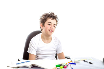 Fototapeta na wymiar Caucasian smooth-skinned boy astonished in front of homework