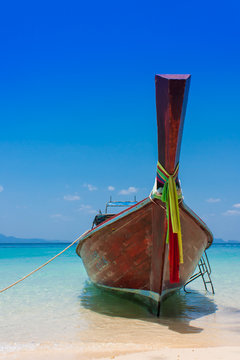 Boat on the beach and blue sky