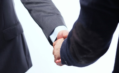 Closeup of a business handshake, on white background