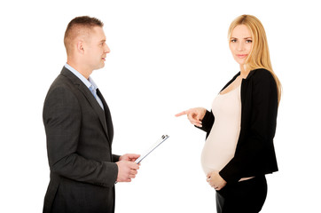 Pregnant businesswoman talking with her partner