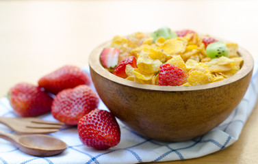 Cereals with fruit in wooden bowl