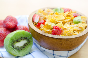 Cereals with fruit in wooden bowl