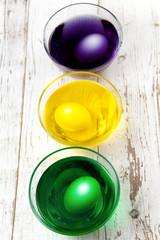Eggs in paint cups