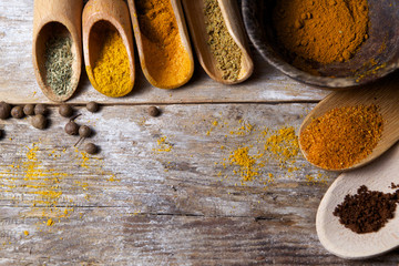 Spices on wooden background