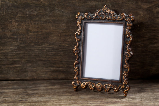Retro frame for photo on wooden
