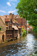 Fototapeta na wymiar Medieval houses along a canal in Bruges, Belgium