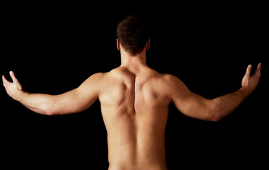 Fototapeta premium Sexy muscular man showing his muscular back.