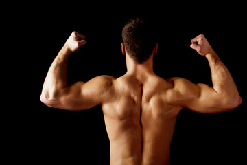 Fototapeta na wymiar Sexy muscular man showing his muscular back.