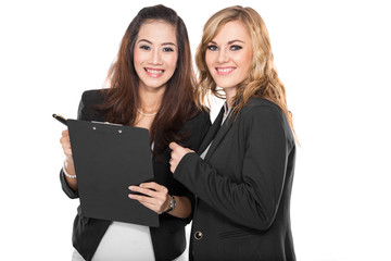 two young businesswoman wtih a clipboard, isolated