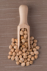 Wooden scoop with chickpeas