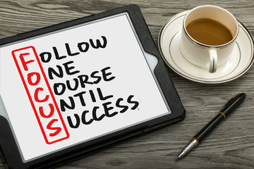 follow one course until success handwritten on tablet pc