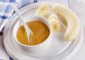 Baby food - bananas puree in  a bowl.