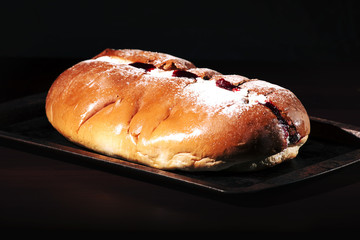 Raspberry jam and cream pastry on a baking tray