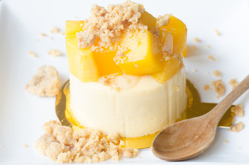 mango cheesecake on white plate