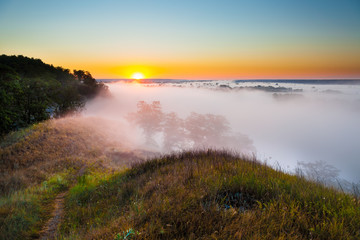 Misty dawn from hill over Valley and the forest