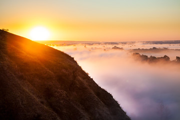 Misty dawn from hill over Valley and the forest