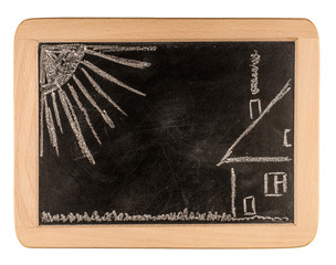 blackboard with a drowing of a house and a familie