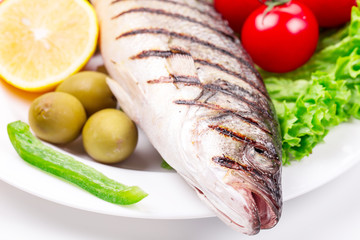 Grilled seabass on plate.