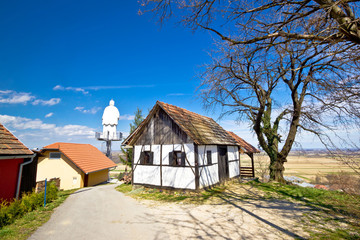 Fototapeta na wymiar Zagorje hills cottage and st. Vinko statue