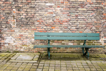 Green Bench Brick Wall