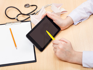 doctor works with tablet pc